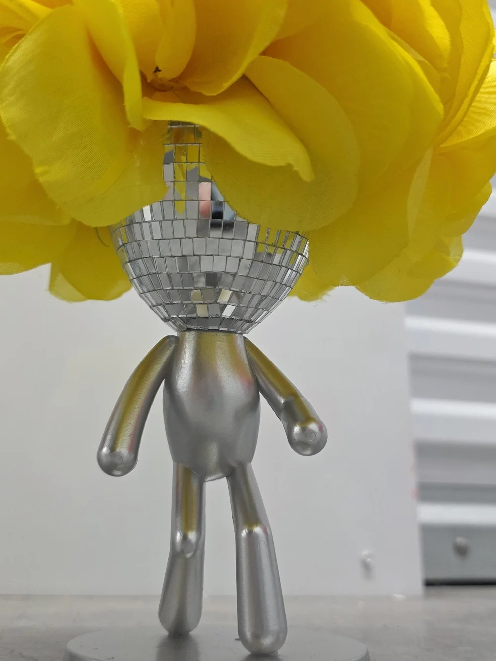 Silver Disco Head Figurine with Bright Yellow Flower Top - Handmade